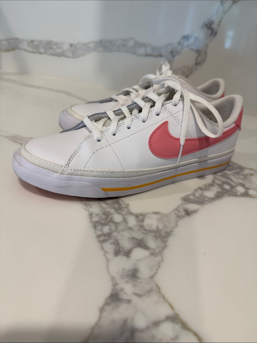Nike White Sneakers with Pink Swoosh and Yellow Accent